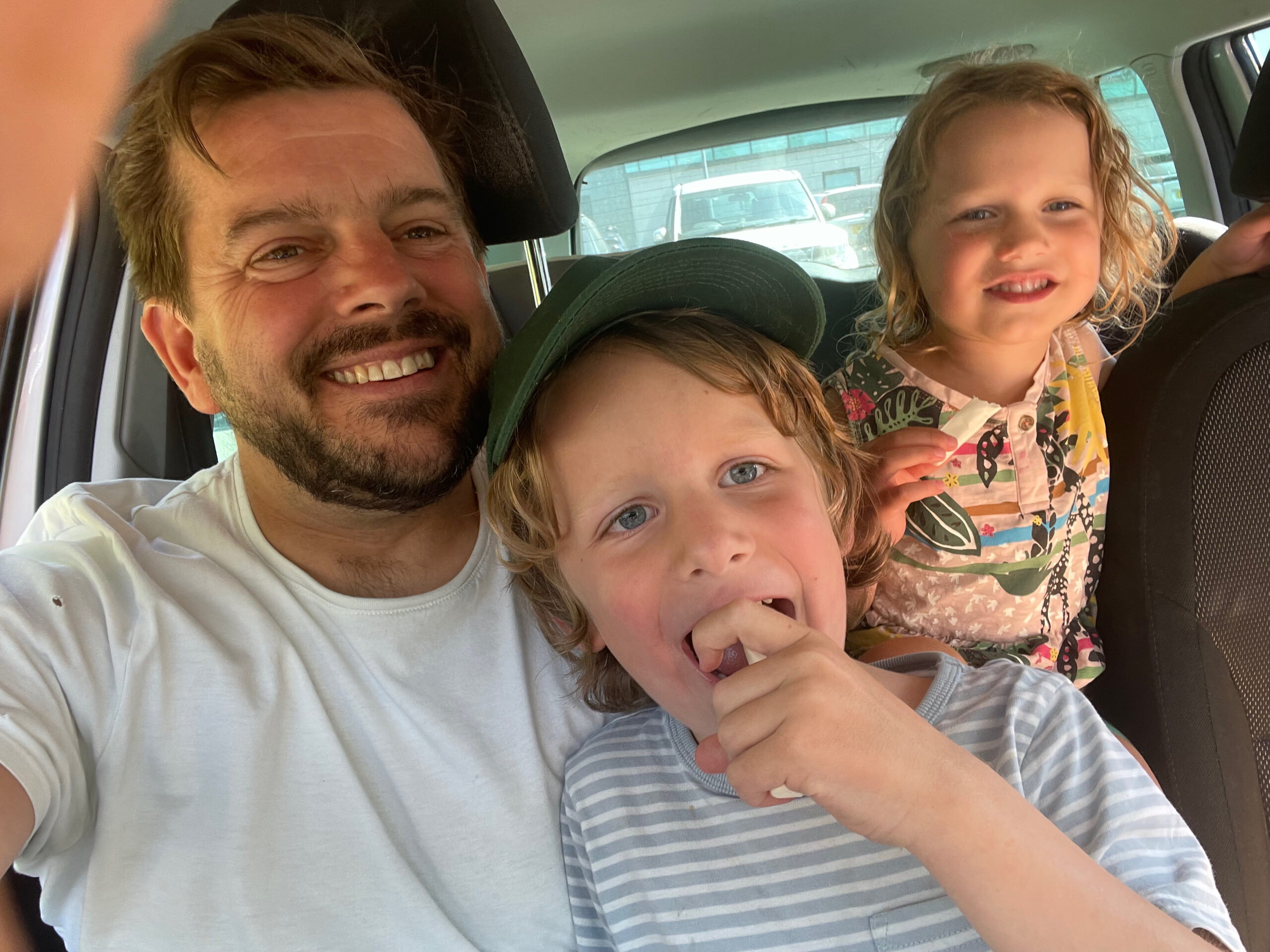 A more recent snap of Phil with the children in the car A more recent snap of Phil with the children in the car